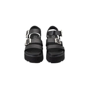Black leather platform sandals by Cult Women featuring two silver bow buckle straps and a chunky sole