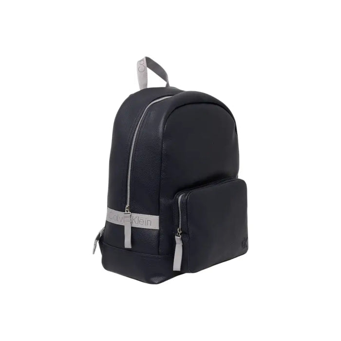 Dark leather backpack with silver and gray accents, featuring a sleek design suitable for daily use