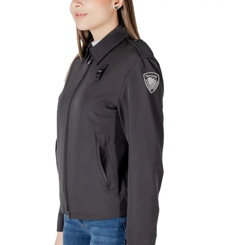 Dark gray collared tactical jacket with structured collar zippered front and embroidered patch on left shoulder