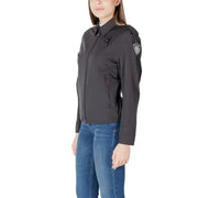 Dark gray collared tactical jacket for women with subtle textured finish and reinforced shoulder patches