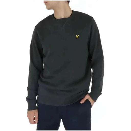 Dark gray Lyle & Scott crewneck sweatshirt with small yellow logo on chest