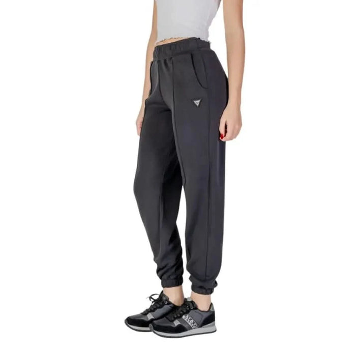 Dark gray jogger sweatpants with elastic cuffs and side pockets from Guess Active