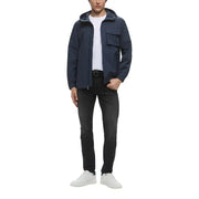 Dark navy hooded jacket with sleek modern design and two front pockets paired with dark wash jeans by calvin klein