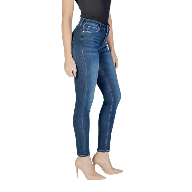 Dark wash skinny denim jeans in blue with slim fit and classic five-pocket design made of denim material