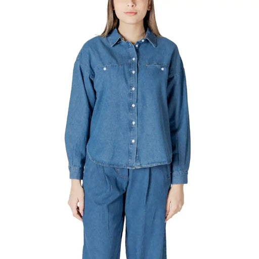 Denim button-down shirt and pants set displayed in a product image