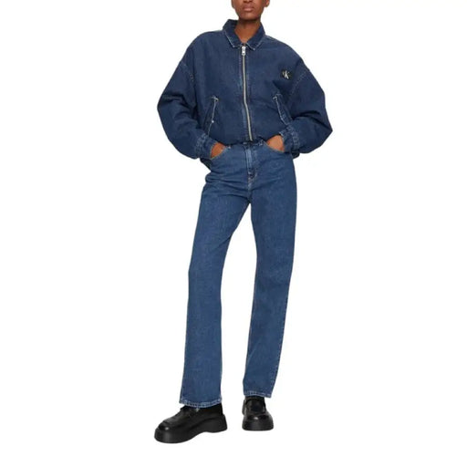 Blue denim jeans and jacket ensemble paired with black loafers for a stylish look