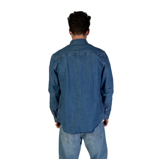 Tommy Hilfiger Men’s Blue Long Button Shirt paired with denim jeans