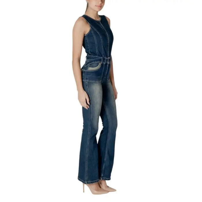 Denim sleeveless jumpsuit with belt and flared legs displayed in the product listing