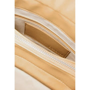 Beige leather brand tag with embossed logo on the Desigual beige convertible handbag rucksack with pockets