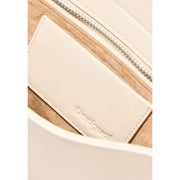 Cream-colored leather interior label embossed with desigual branding in beige polyester handbag with zip pocket