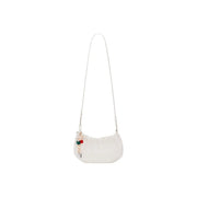 Desigual beige polyester shoulder bag with a plush off-white texture, slender white strap, and decorative red green keychain