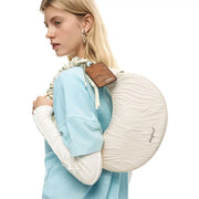 Cream-colored Desigual circular handbag with quilted polyurethane surface and zip pocket for secure storage