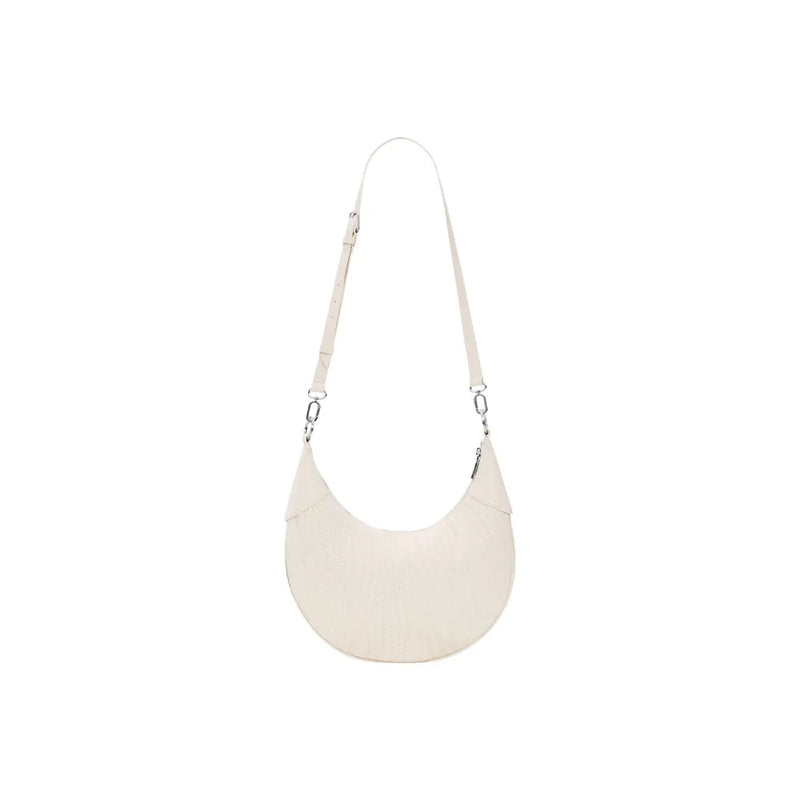 Cream-colored leather crescent-shaped crossbody bag with slender adjustable strap and silver hardware by desigual