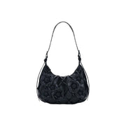 Desigual black leather hobo bag with quilted diamond pattern and dimensional floral appliqués featuring interior pocket