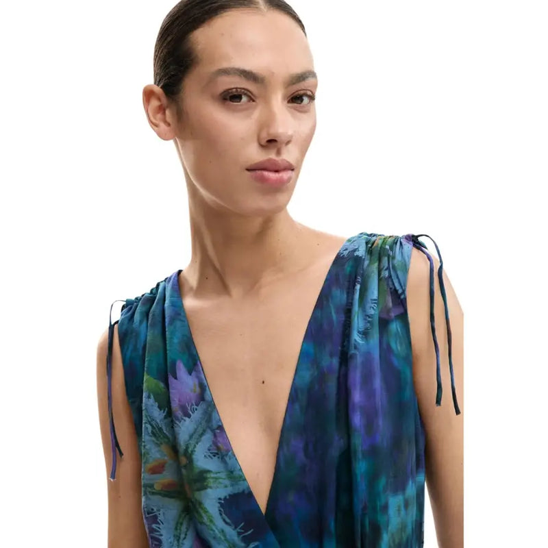 Desigual blue sleeveless v neck jumpsuit for women with adjustable tie straps and vibrant blue and purple floral print