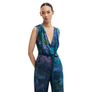 Desigual blue sleeveless v neck jumpsuit for women with vibrant blue and purple floral print and adjustable thin straps