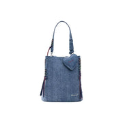 Denim blue Desigual zippered bucket bag with heart-shaped charm and colorful braided accents with pockets