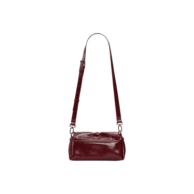A sleek glossy burgundy leather Desigual bordeaux women crossbody bag with button closure and inside pocket