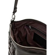 Black leather handbag with floral appliqué detailing and silver-toned zippers shown from the back side