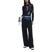 Women’s long-sleeve black floral knit sweater with colorful abstract patterns