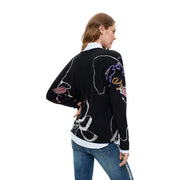 Pull Desigual pour femme en maille viscose noire à col V orné de motifs abstraits animaux et floraux colorés et audacieux.