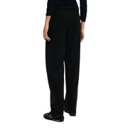 Pantalon Desigual pour femme, en viscose noire, jambes larges, poches, tissu lisse et coupe épurée.