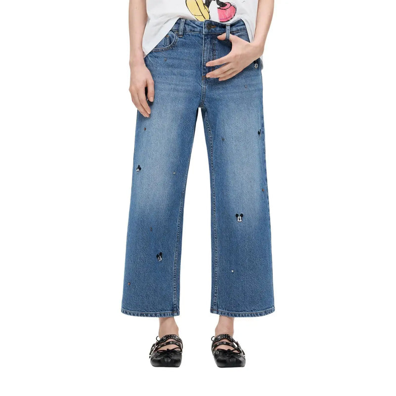 Jean Desigual pour femme en denim de coton bleu à jambes larges, orné d'une broderie ludique représentant Mickey Mouse noir.