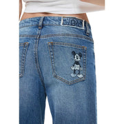 Jean Desigual pour femme en denim de coton bleu avec poche brodée Mickey Mouse noir et blanc à l'arrière
