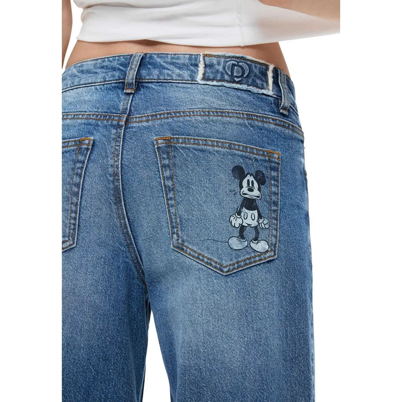 Jean Desigual pour femme en denim de coton bleu avec poche brodée Mickey Mouse noir et blanc à l'arrière