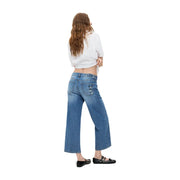 Jean Desigual bleu en denim de coton à jambes larges, dos visible avec un empiècement usé sur la poche