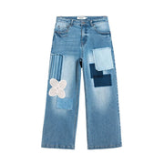Jean Desigual pour femme en denim de coton bleu clair avec un motif patchwork agrémenté de dentelle et de détails en tissu rayé