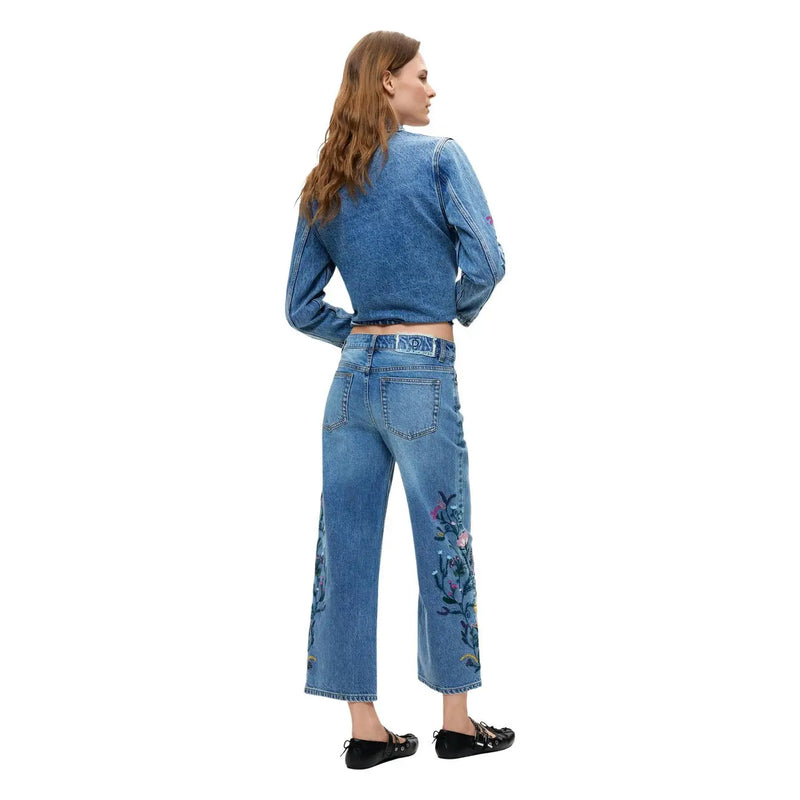 Jean en denim de coton bleu Desigual avec broderie florale le long de la jambe extérieure, taille haute et coupe courte top