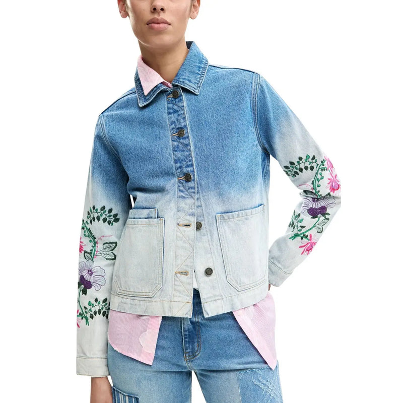 Denim jacket with gradient fade blue to white and vibrant pink purple floral embroidery on sleeves by Desigual women