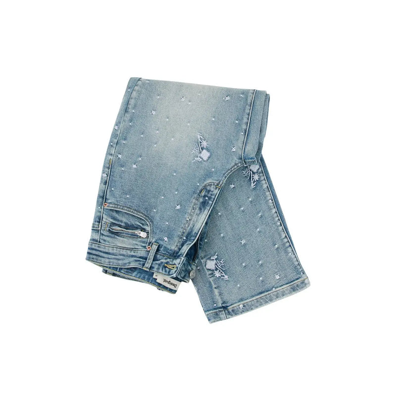 Jean Desigual pour femme en coton stretch bleu clair, orné de motifs d'étoiles délavés, de broderies discrètes et de déchirures intentionnelles.