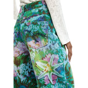 Jean Desigual pour femme en coton bleu clair à fleurs, imprimé étoiles de mer vert turquoise, rose et violet, coupe large.