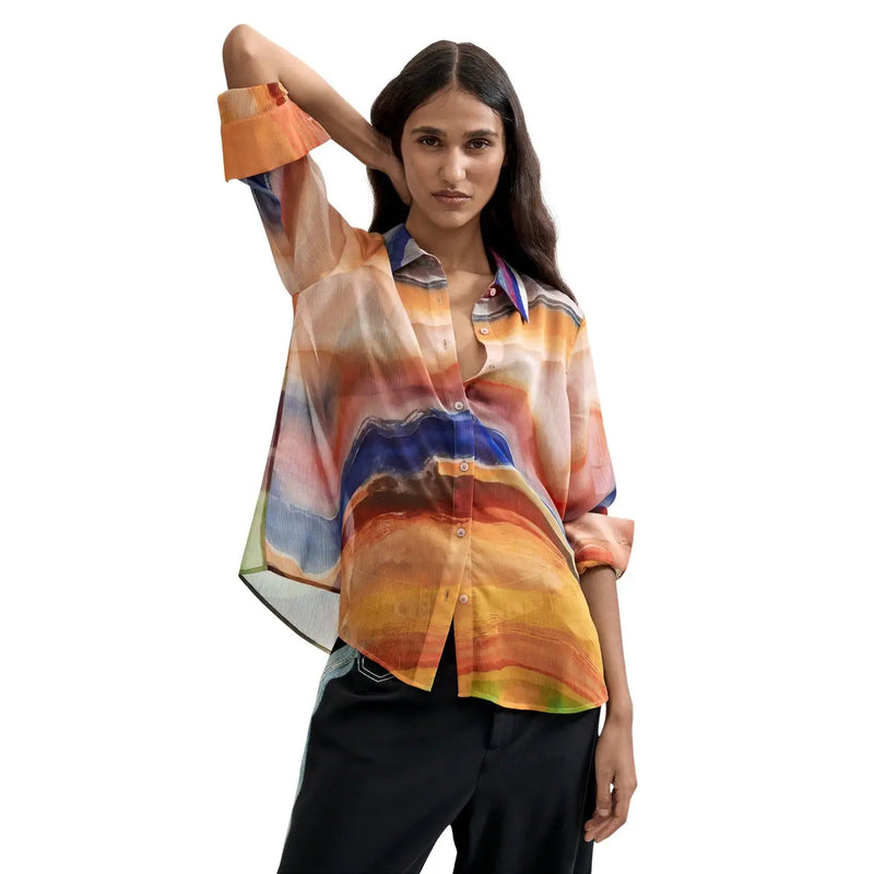 A flowing semi-sheer Desigual women orange polyester blouse with vibrant abstract print in shades of orange blue and yellow