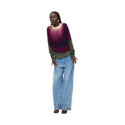 Pull Desigual pour femme en maille viscose violette, avec dégradé violet-vert, poignets vert olive et logo discret sur la manche.