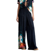 Pantalon noir à jambes larges en viscose de Desigual orné d'un imprimé floral tropical éclatant sur le côté