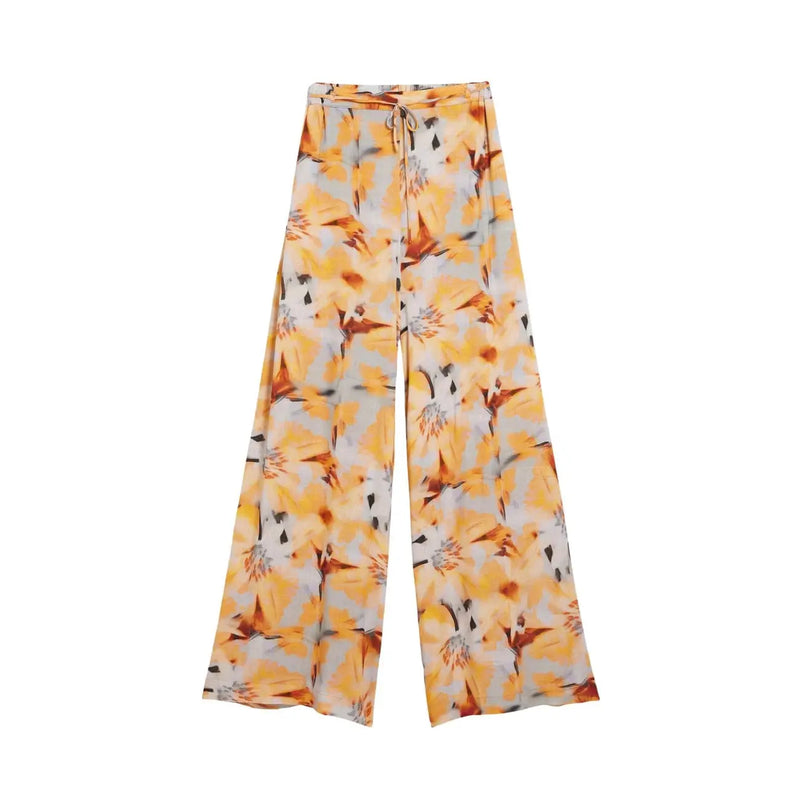 Pantalon Desigual pour femme, en viscose orange à motif floral, coupe large, taille élastiquée et cordon de serrage, avec des accents jaune vif et gris.