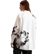 Desigual women white long cotton shirt with bold black bird and foliage prints on sleeves and back shown from the back