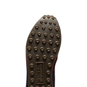 Semelle en caoutchouc marron avec crampons circulaires et diadora logo en relief sur diadora Baskets homme en cuir bleu style rallye ciré