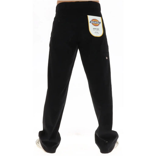 Pantalon Dickies noir en coton pour homme, au design classique et résistant, avec des détails de couture discrets, idéal pour l'automne et l'hiver.