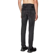 Black slim-fit jeans with a distressed look and dark wash.