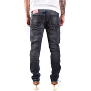 Jean Diesel homme bleu foncé à effet usé, 100 % coton, aspect vieilli.