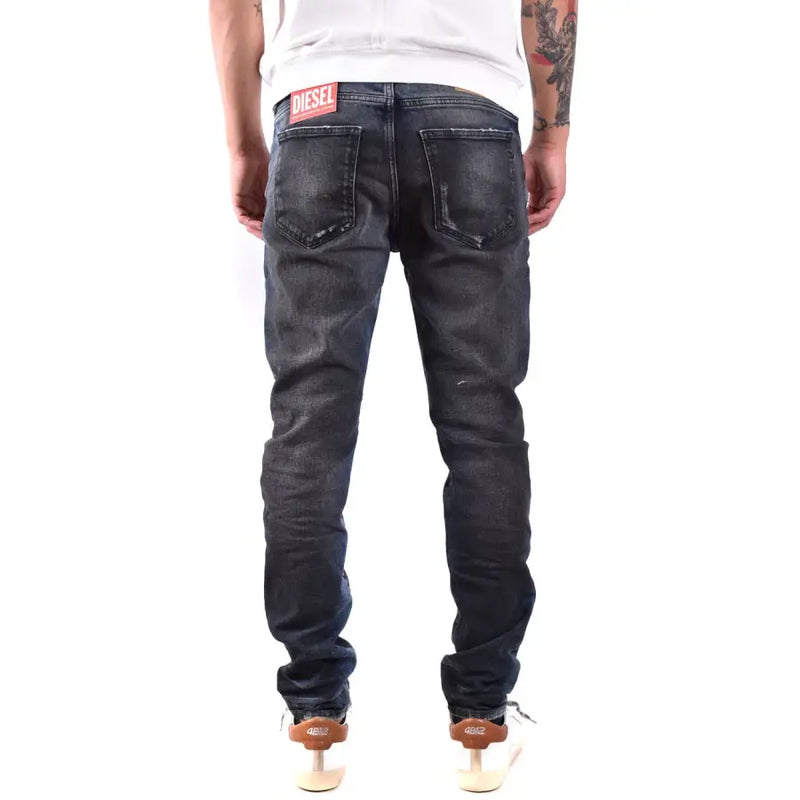 Jean Diesel homme bleu foncé à effet usé, 100 % coton, aspect vieilli.
