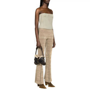 Mini sac en cuir noir doublé de peau lainée et orné de boucles, assorti à Diesel femme en coton bleu clair top