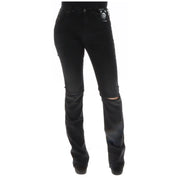 Diesel Jean noir en coton déchiré pour femme, laissant apparaître l'arrière, genoux usés et étiquette de marque sur la poche.