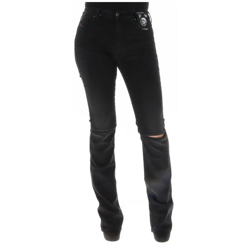 Diesel Jean noir en coton déchiré pour femme, laissant apparaître l'arrière, genoux usés et étiquette de marque sur la poche.