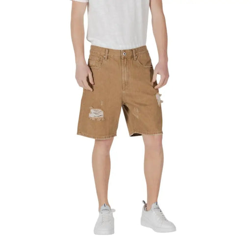 Distressed brown denim shorts displayed in a product listing for casual wear