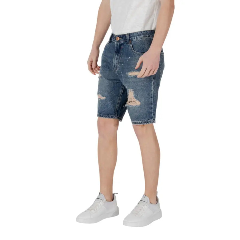 Distressed denim shorts with paint splatter detail, casual summer fashion display